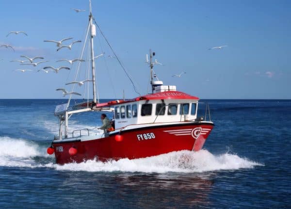 Red fishing boat at sea